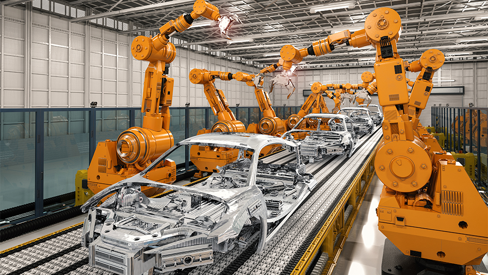 Machines building a steel car frame 