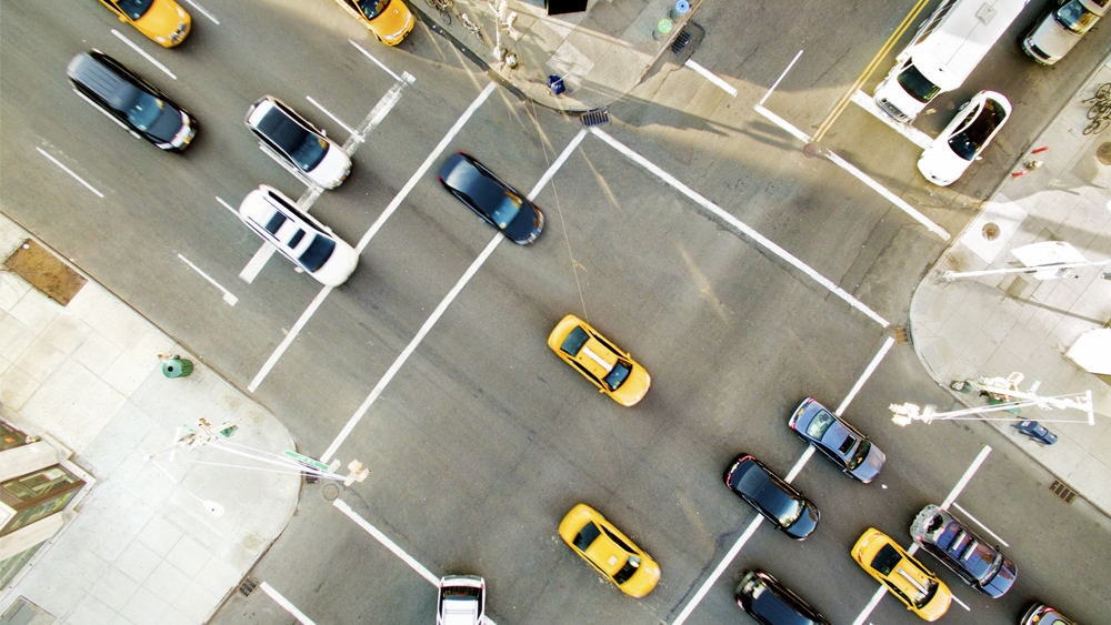 An overhead view of a traffic intersection 
