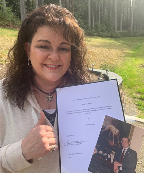 Joni Lora, the daughter of Dr. James Hennigan, with a copy of Stephen Powe's final paper, and a photo of Dr. Hennigan. 