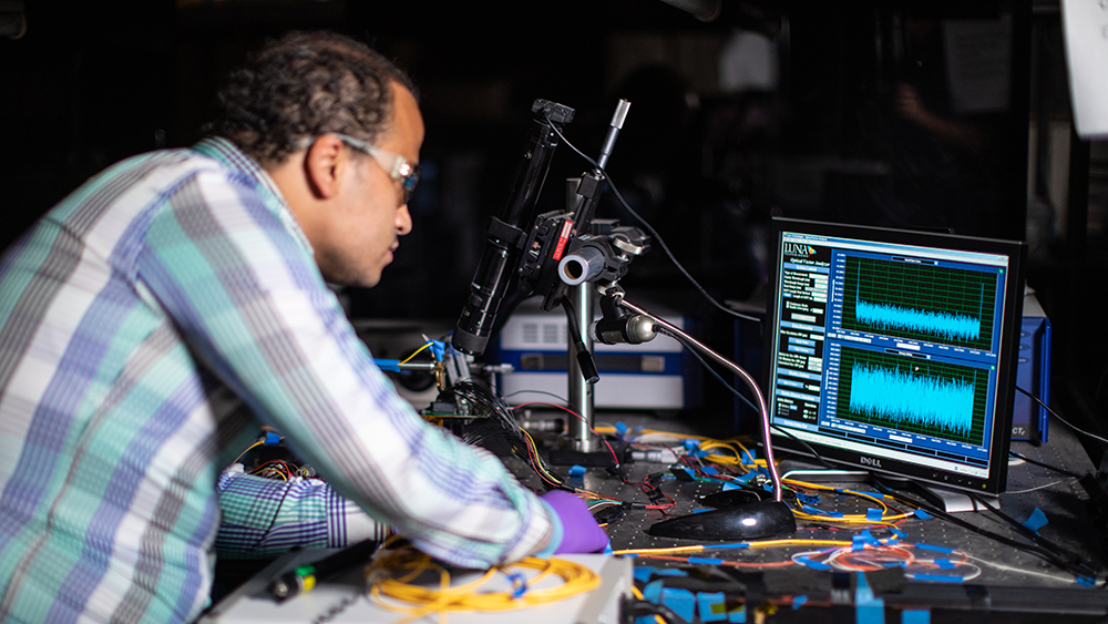 Ramy Rady working with wires in lab