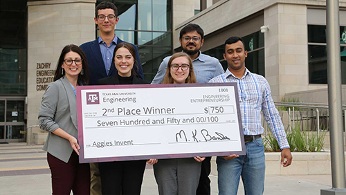 ResponseAid, the second-place team from Aggies Invent, holding a giant check for $750. 