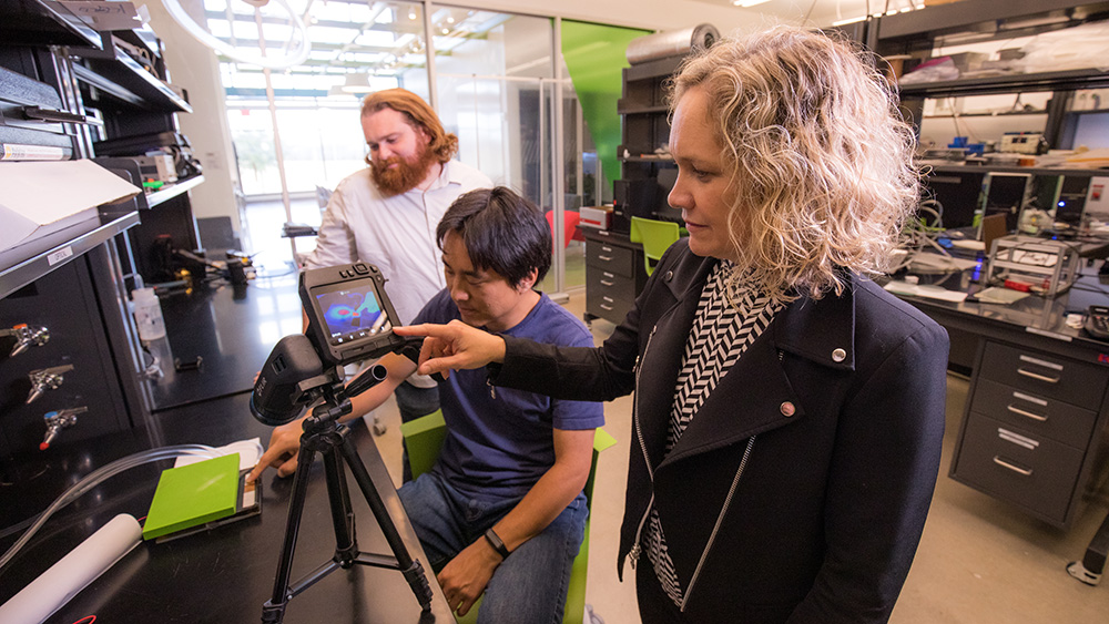 Drs. Cynthia Hipwell and Jonathan Felts oversee a demonstration of new touchscreen technology that simulates virtual shapes using temperature variation.