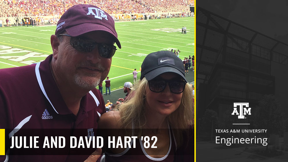 Julie and David Hart posing for a photo at an Aggie football game in Kyle Field. 