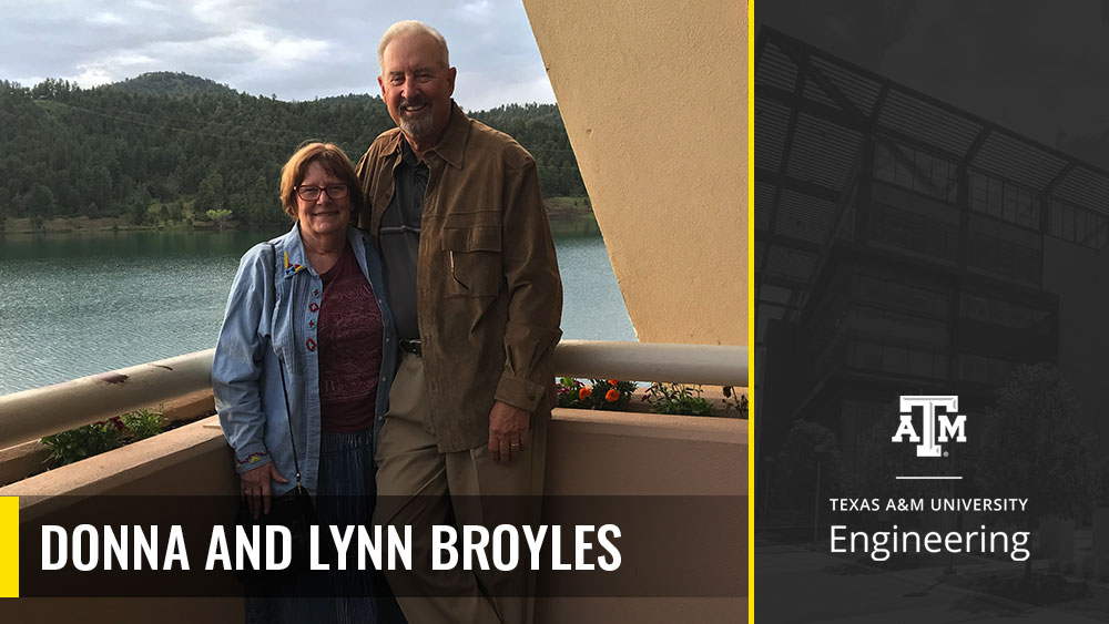 Donna and Lynn Broyles posing for a photo on a balcony overlooking the mountains.