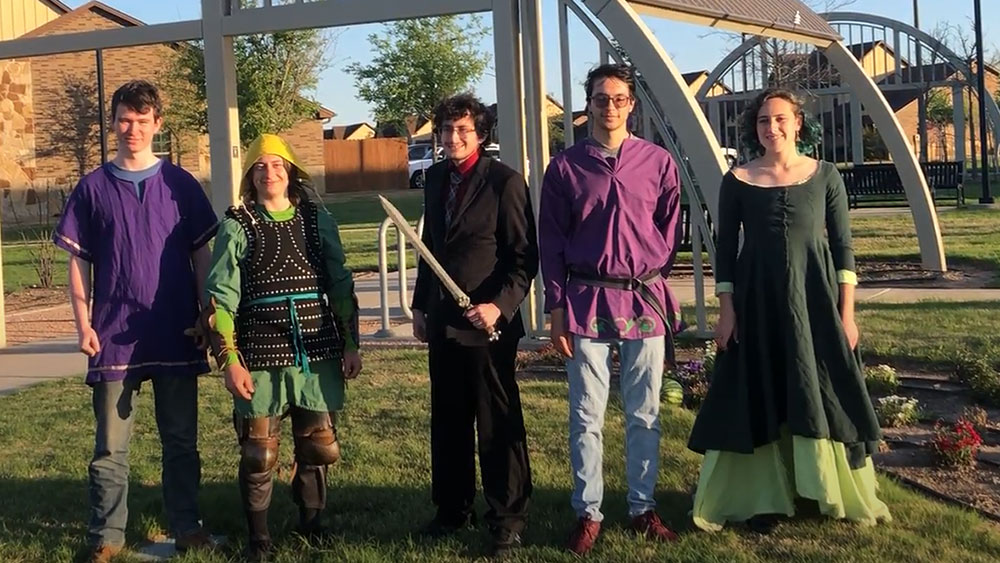 Five undergraduate students dressed in costume