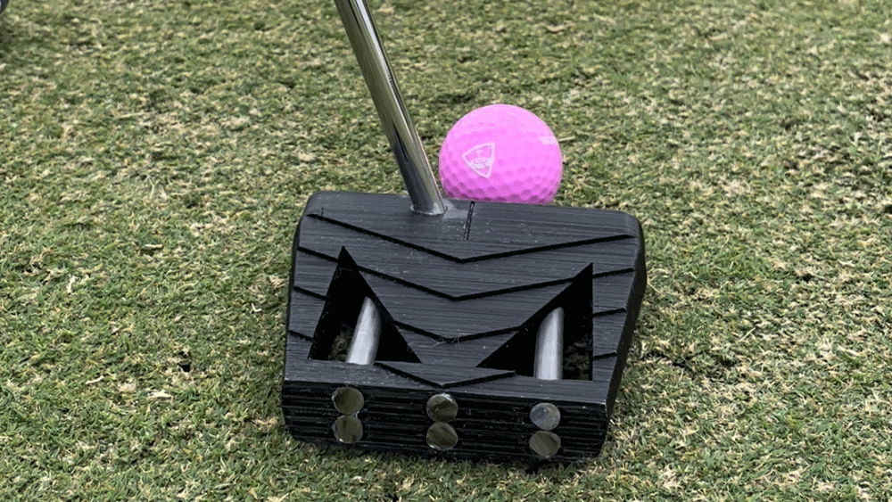 Putter and pink golf ball 