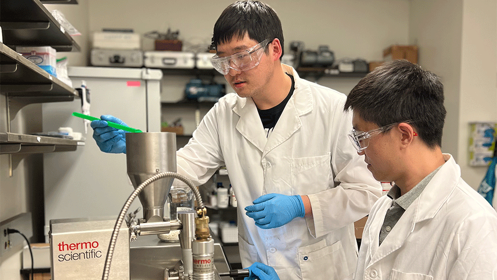 Graduate students Yufeng Quan and Ruiqing Shen use a bench-scale twin screw extruder for the sustainable and efficient manufacturing of metal-organic framework-based polymer nanocomposites. 
