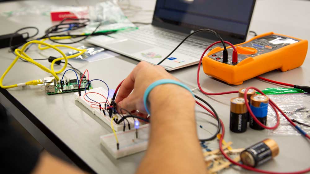 A student working with an electric circuit.