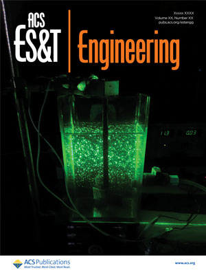 cover of February 2023 ACS ES&amp;T Engineering magazine featuring a photo of a green laser on a jar filled with water, tubes and wires