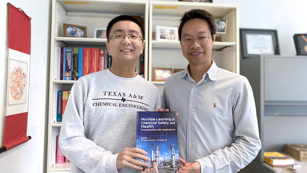Pingfan Hu (Left) and Dr. Qingsheng Wang holding their book “Machine Learning in Chemical Safety and Health: Fundamentals with Applications.” in Dr. Wang's office. 