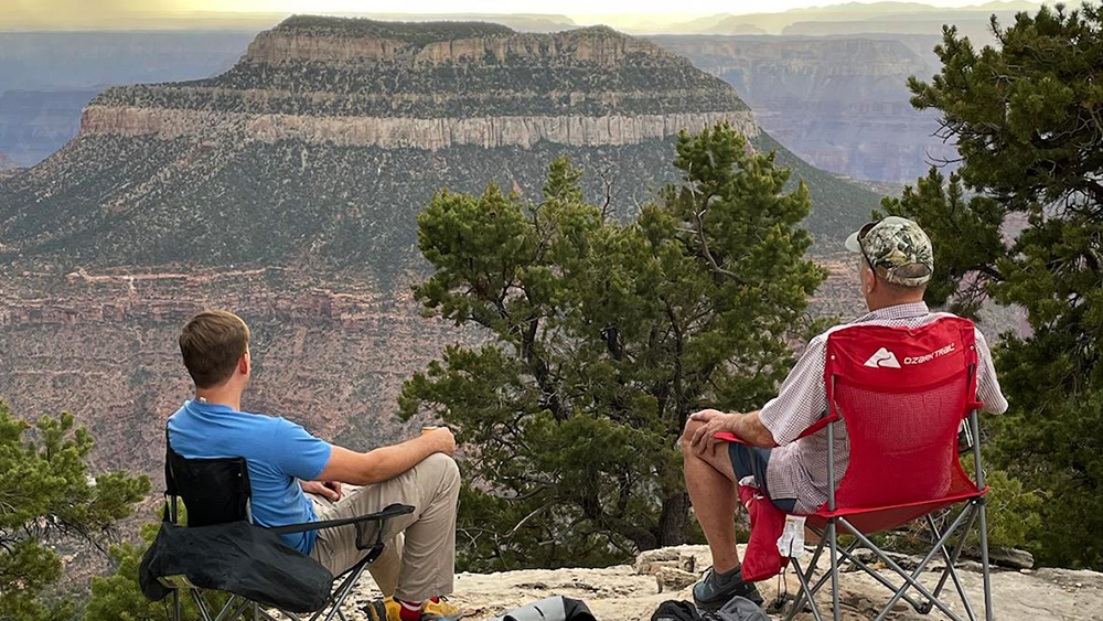 Alan Padfield and his son, Russell Padfield, looking out at Steamboat Mountain, Grand Canyon North Rim.