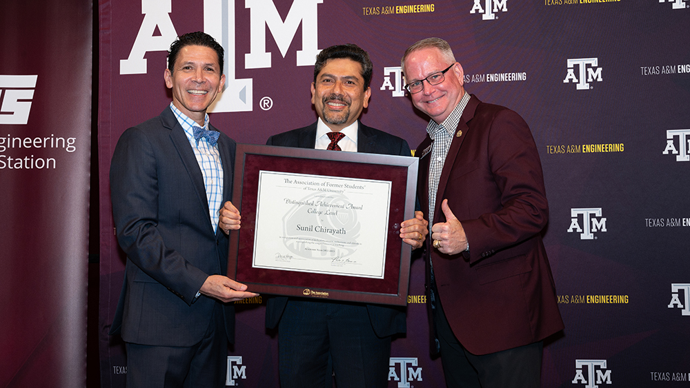 From left, Dr. John E. Hurtado, Dr. Sunil Chirayath holding his plaque, and Marty Holmes ’83.