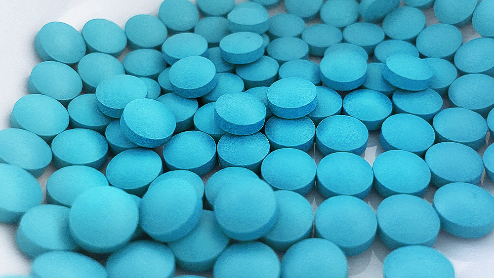 Manufactured pills in a container.