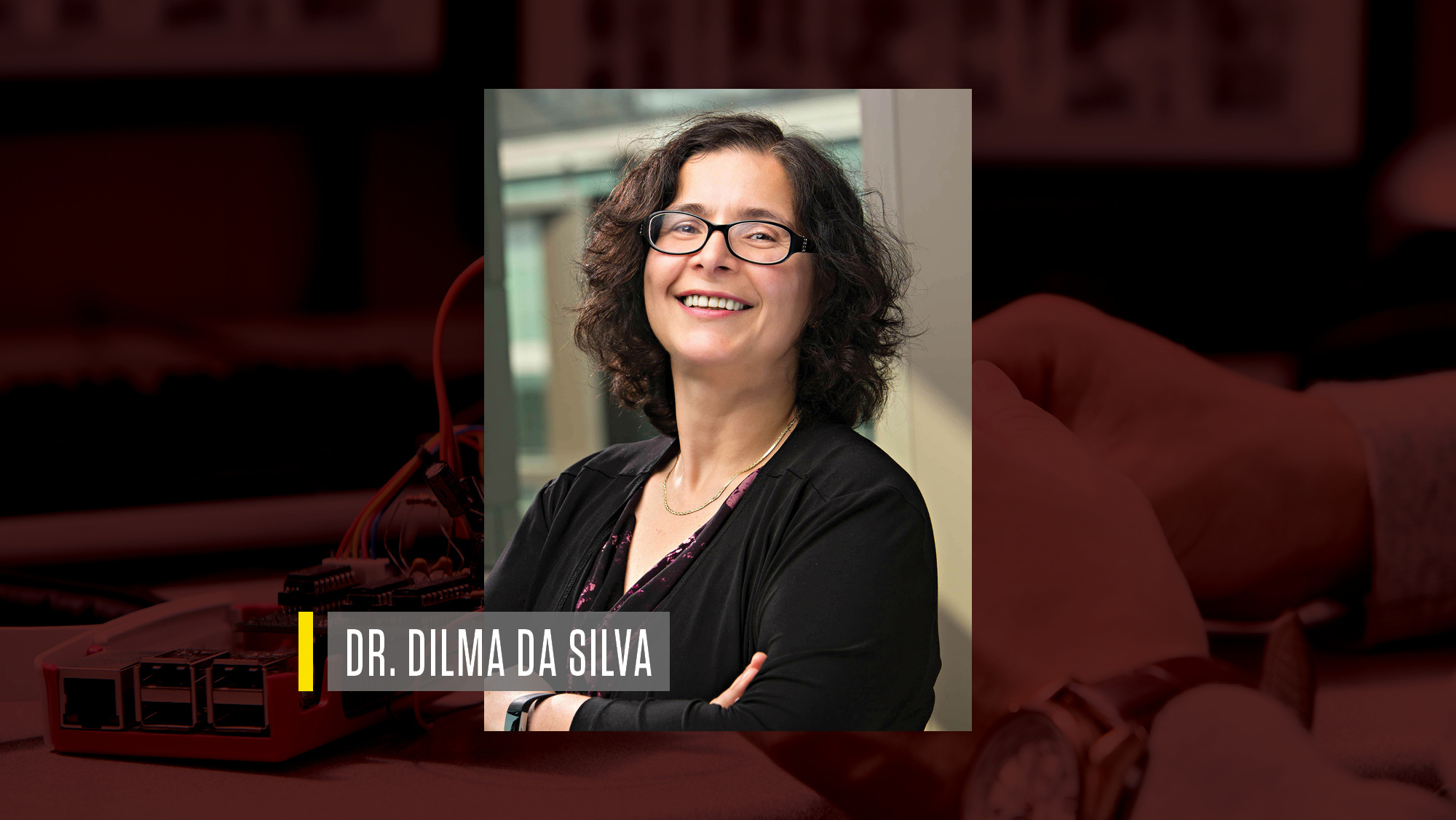 Headshot of Dr. Dilma Da Silva on a maroon background.