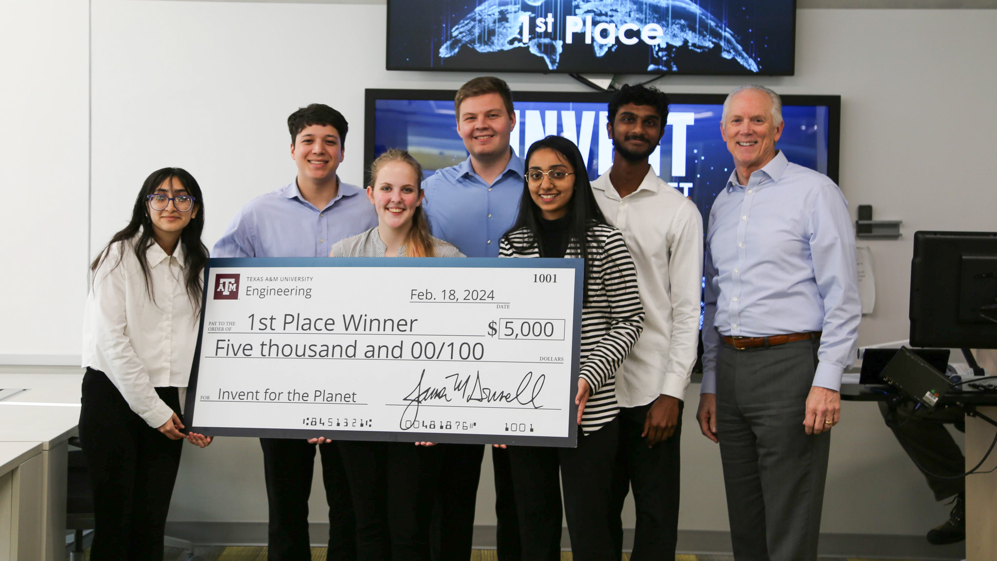 Team Water Wise being presented a jumbo check for first place with a grand prize of $5,000.