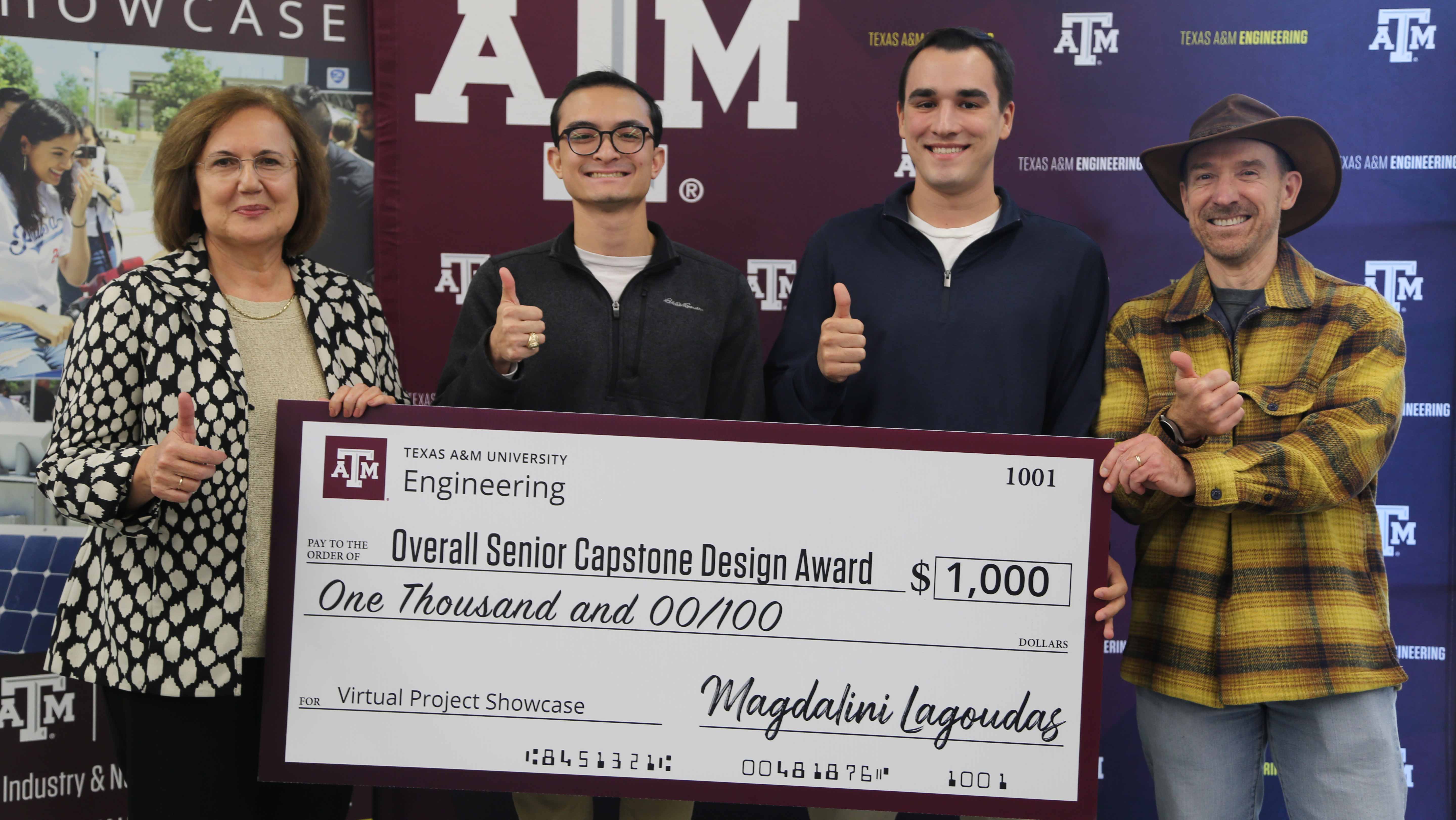 Eric Hyche and Matthew Edge receive a check for winning first place at the VPS.