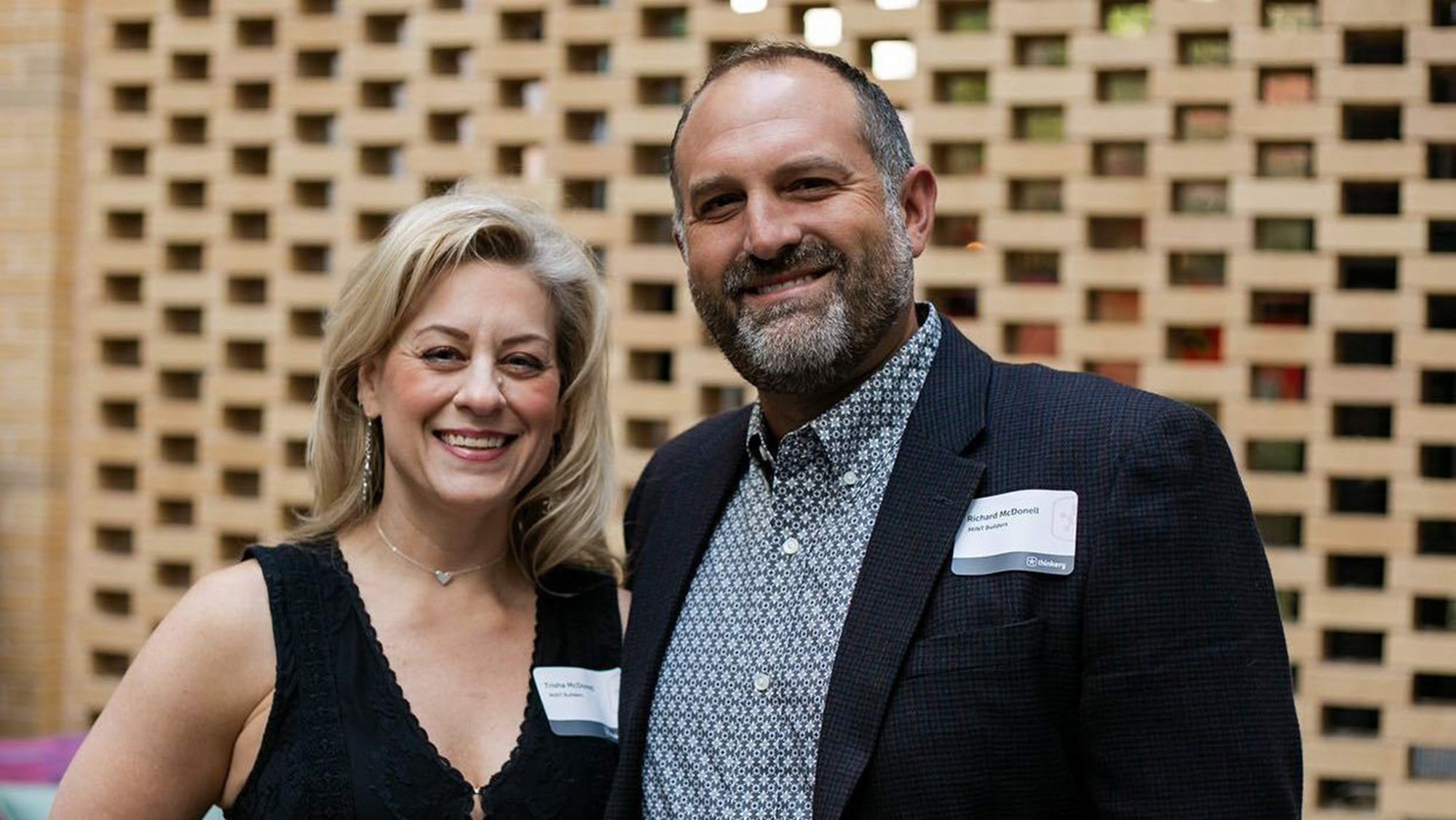 Man and woman smiling.