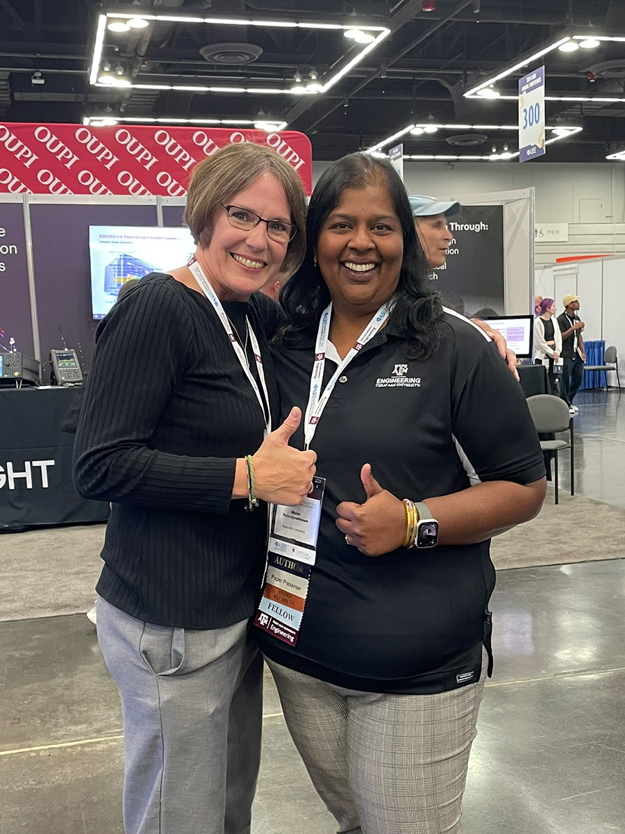 Two women smiling for a photo.