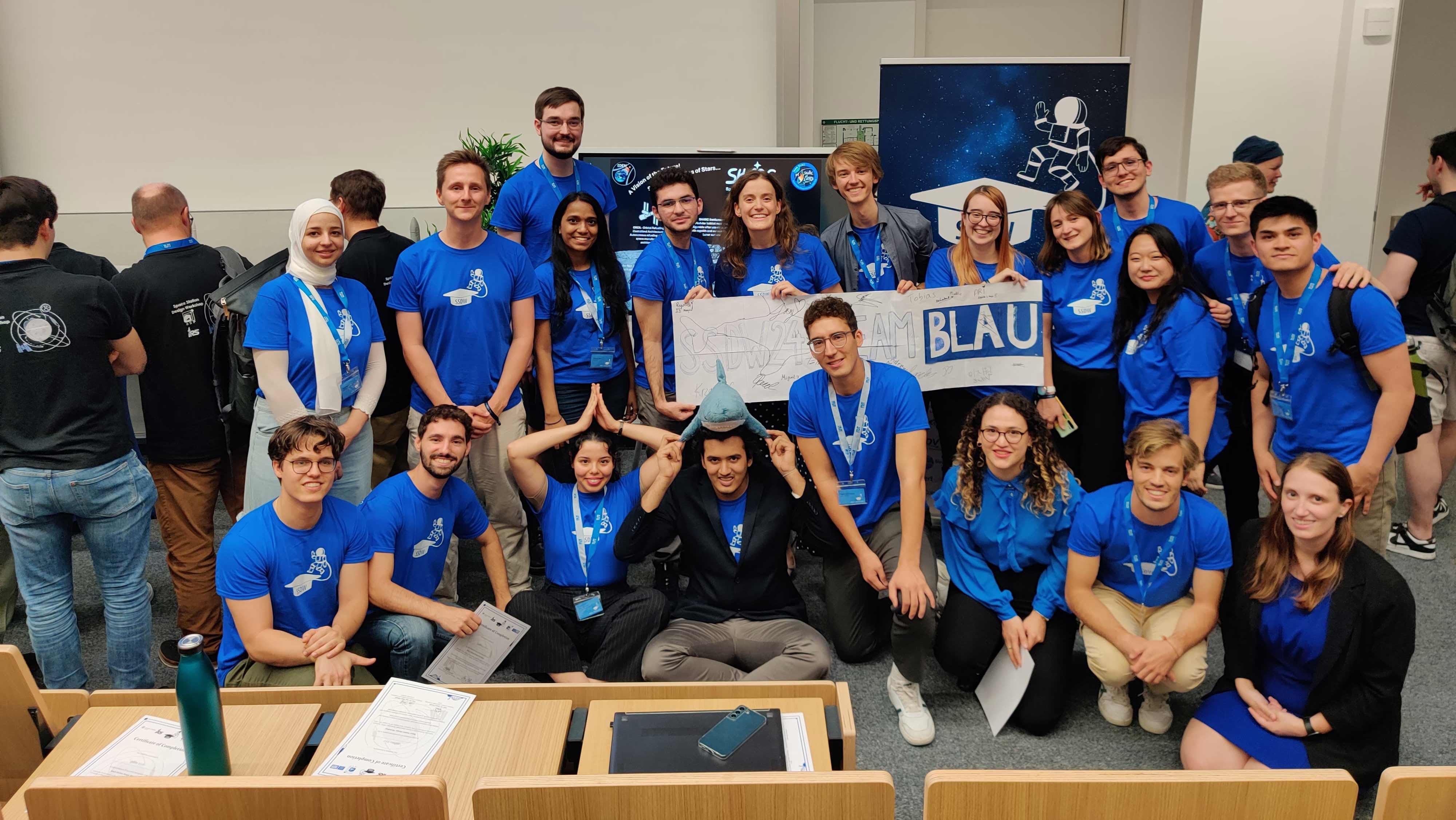 A group of people dressed in blue shirts.