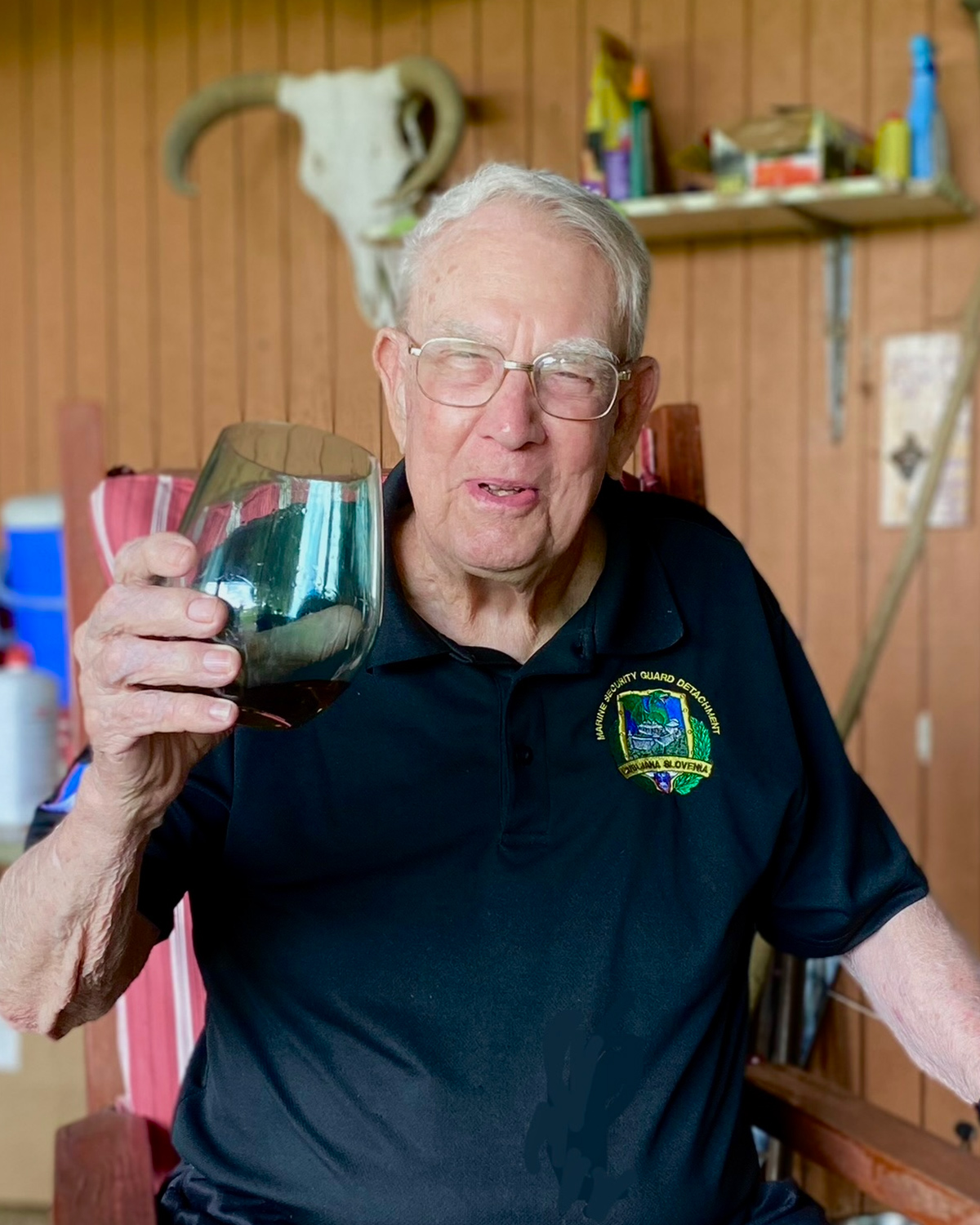 A man holding a glass of wine.