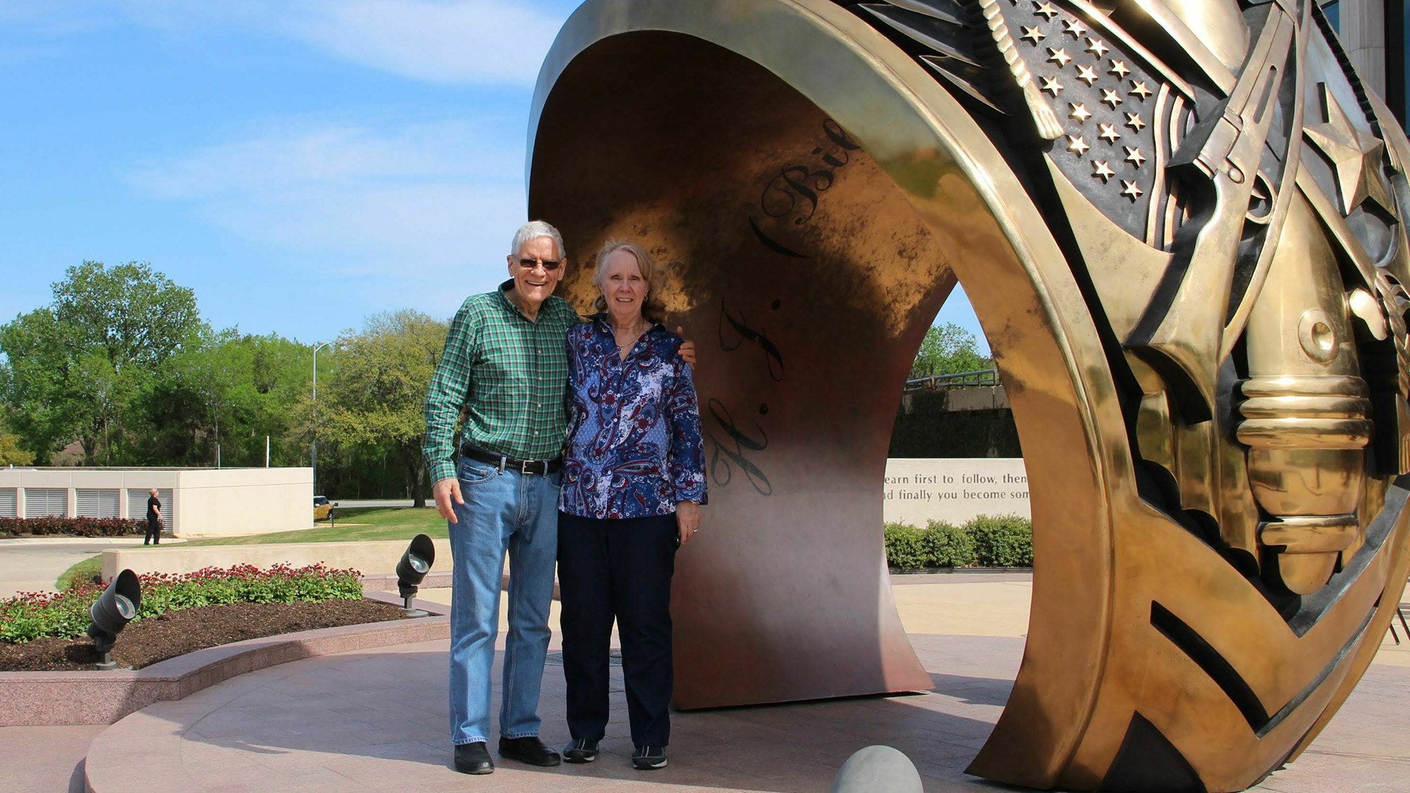 Man and Woman at statue.