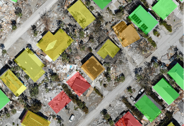 An aerial view of houses damaged by hurricanes.