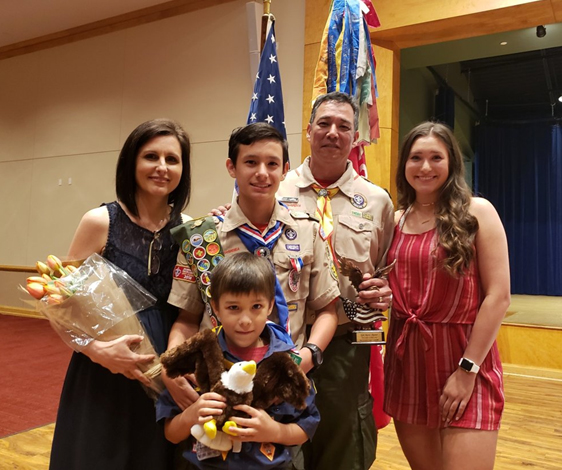 A family of five at a celebration.