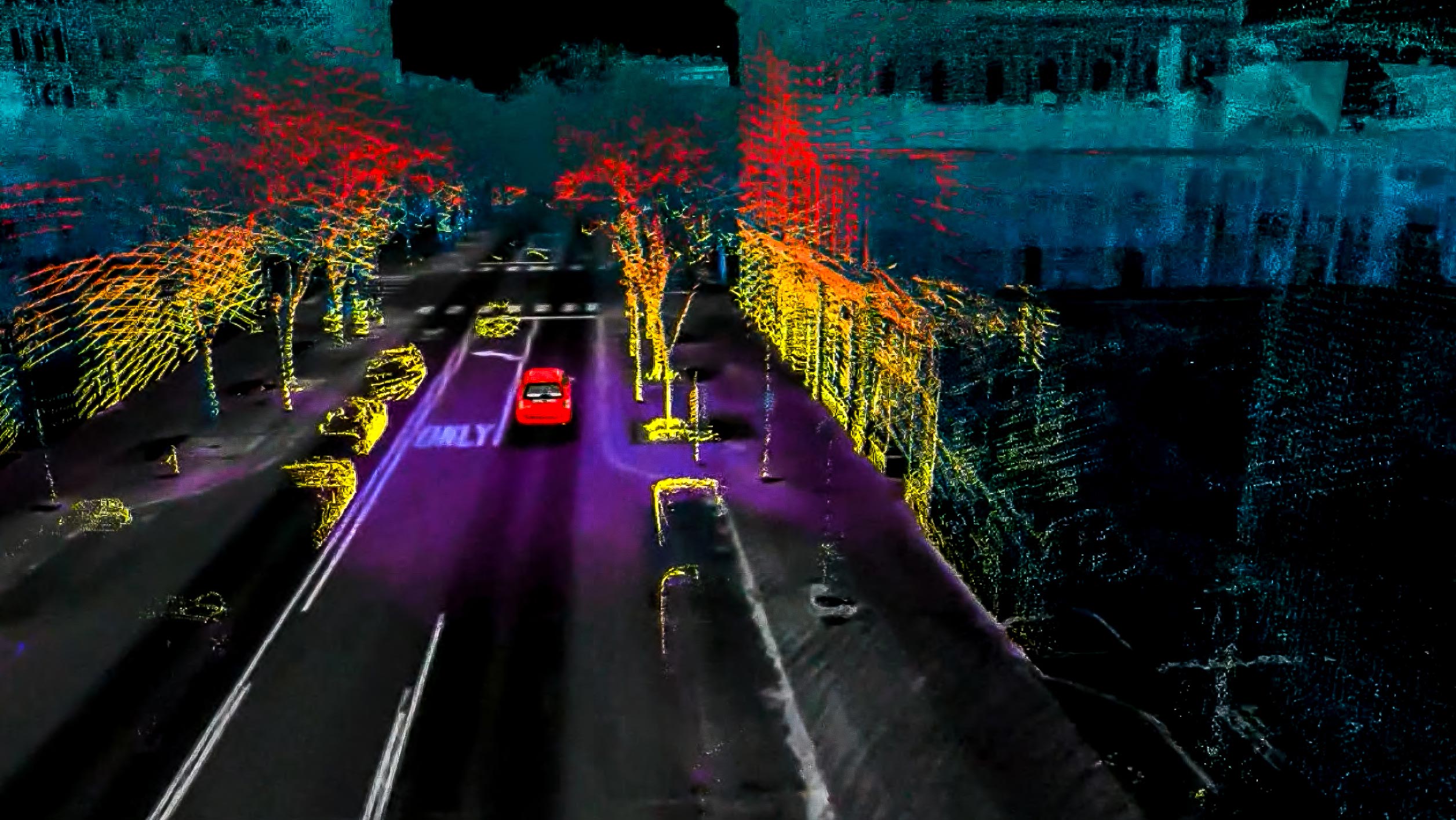 Aerial view of a city street depicted in a 3D point cloud format.