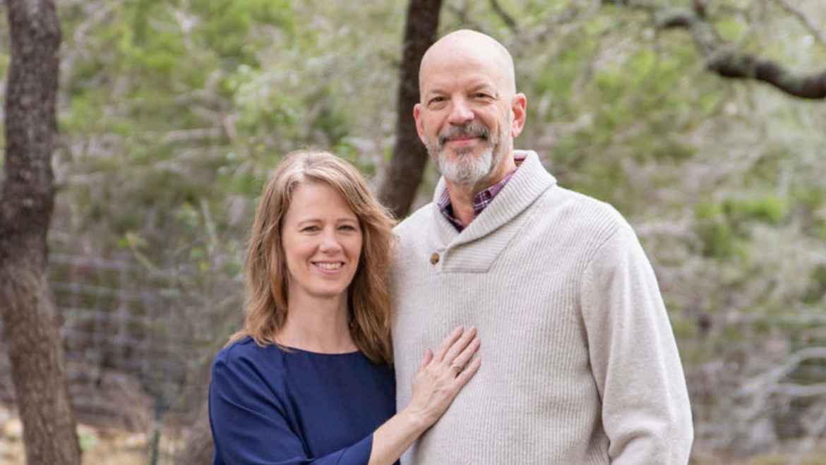 Two people posing for a photo. 