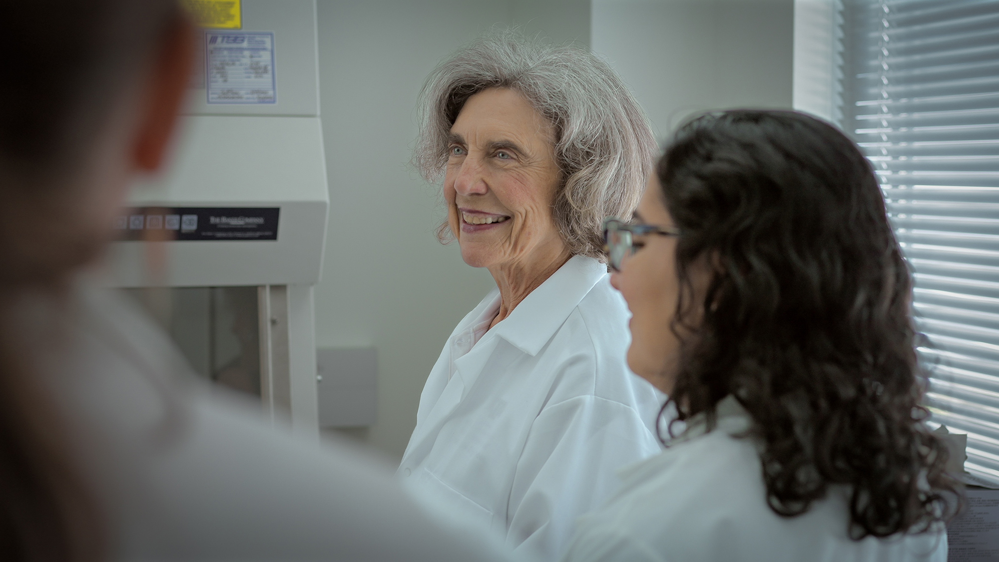 A group of people standing in a lab.