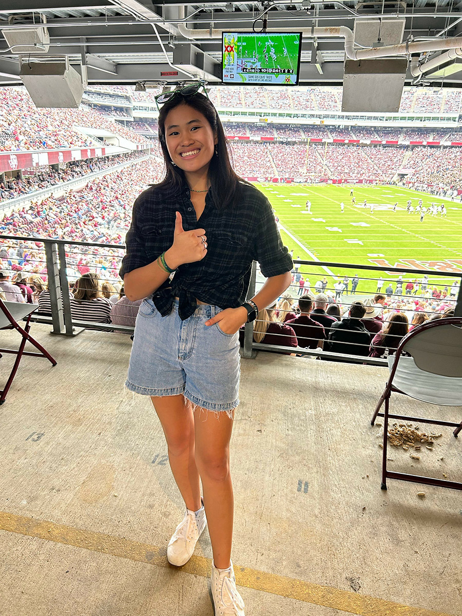 Karen Grace Bryan posing at a sporting event.
