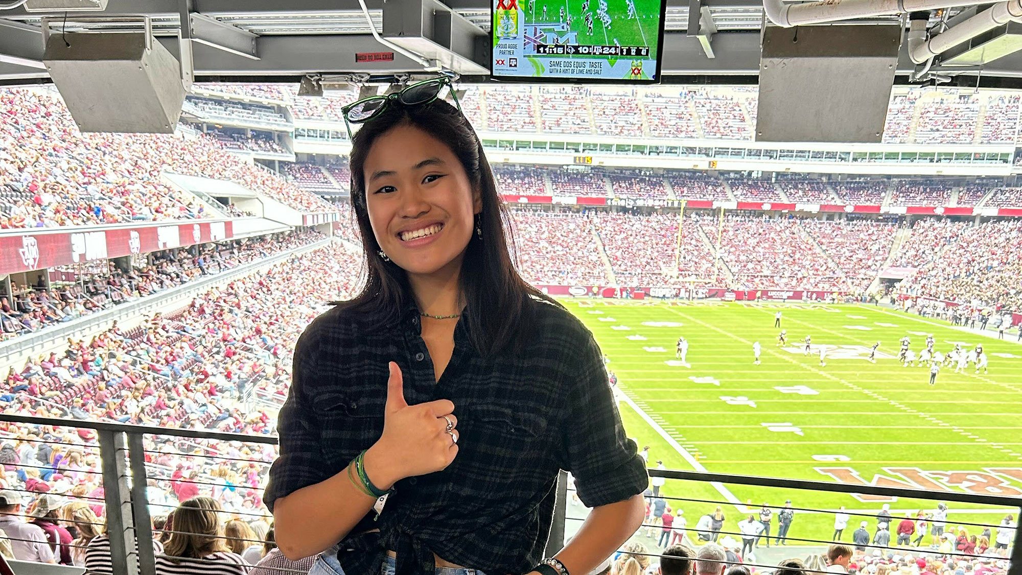 Karen Grace Bryan posing at a sporting event.