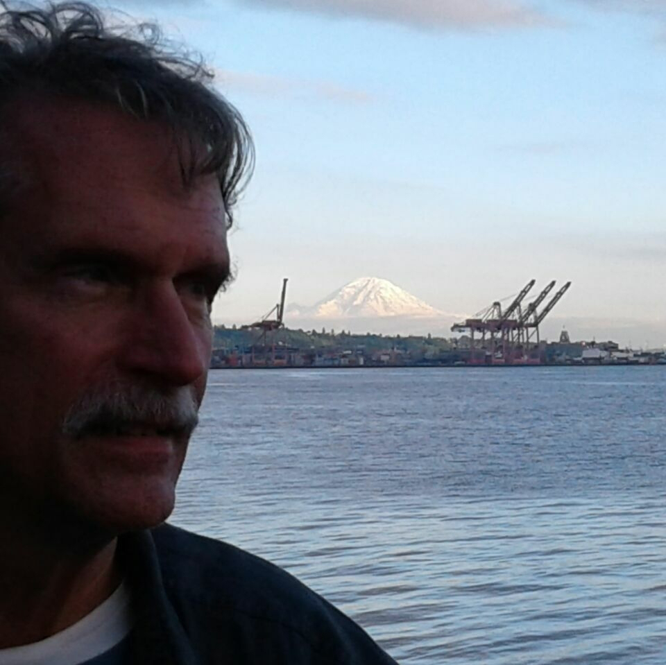 Man in front of mountain
