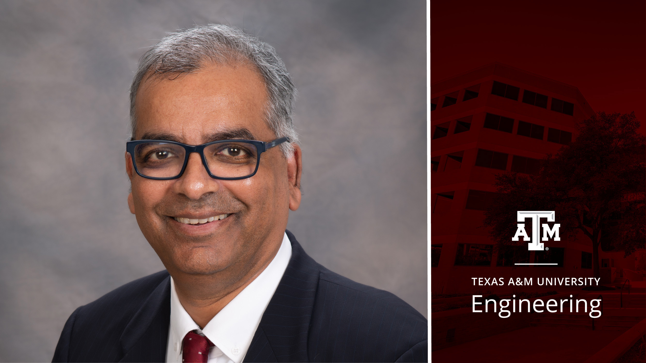 Headshot of a man with a maroon background.
