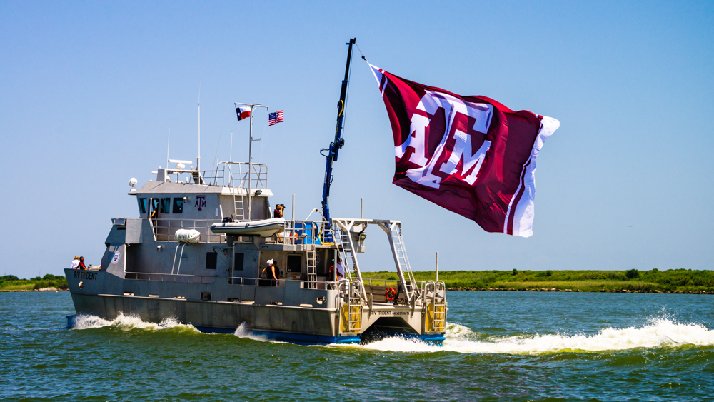 The Trident ship in Galveston pulling a Texas A&amp;M flag