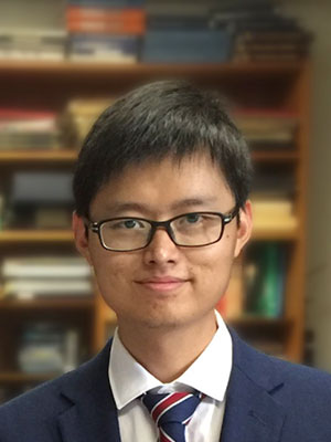 Dr. Chang Xu headshot in front of a bookcase