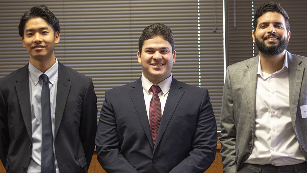 three smiling doctoral student winners of the Harold Vance Department of Petroleum Engineering student paper contest