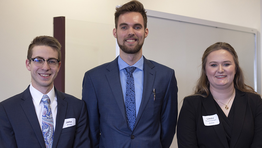three smiling junior division student winners of the Harold Vance Department of Petroleum Engineering student paper contest