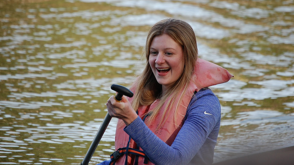 A student on a canoe
