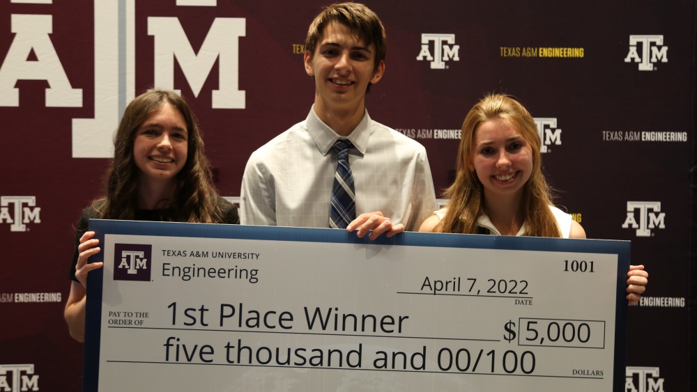 The first place winners of Invent for the Planet 2022, Aquabox from Texas A&amp;M University, hold their jumbo check of $5,000. 